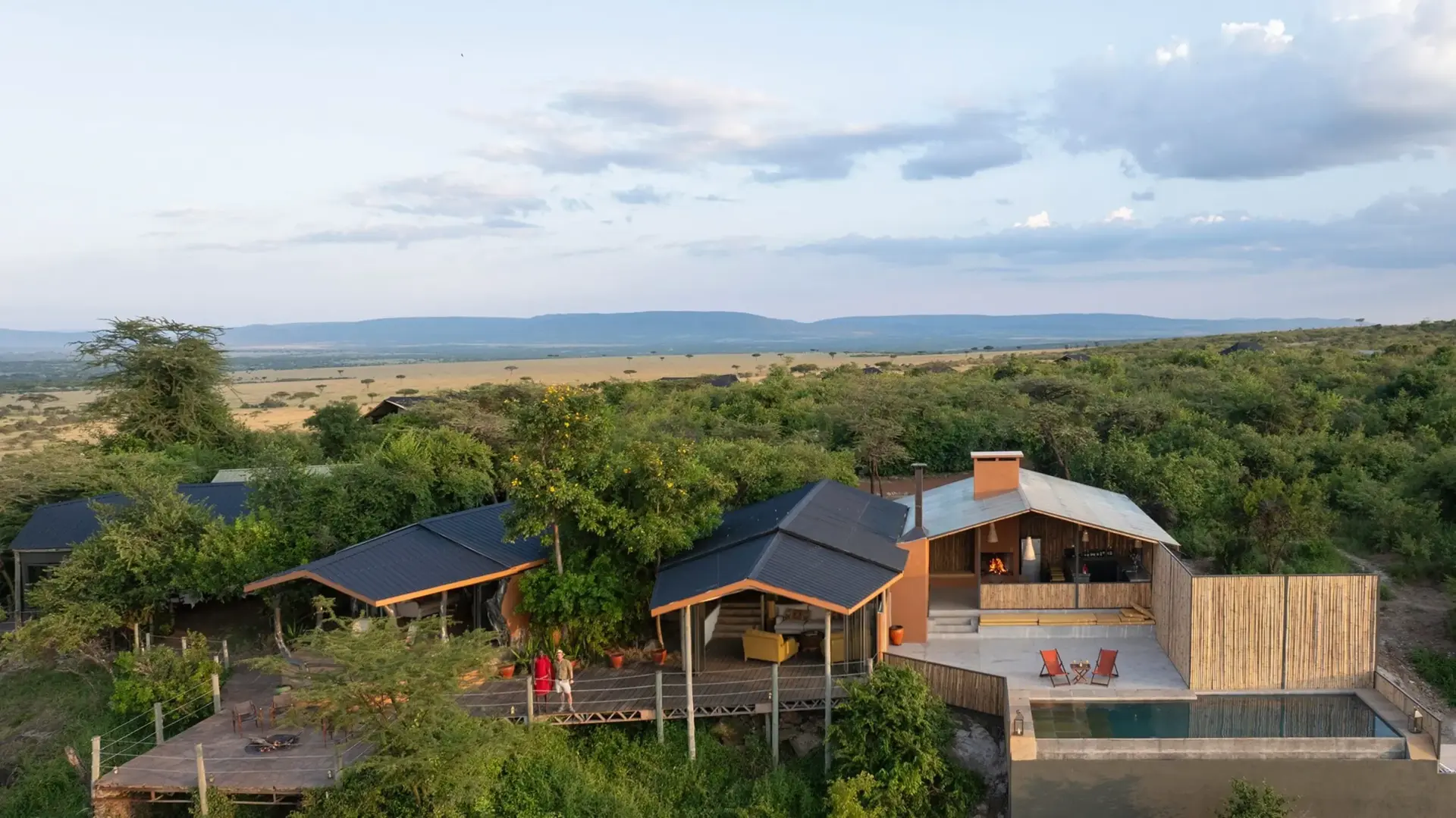 A camp main area and pool overlooking the plains